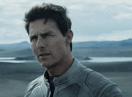 Movie gif. Tom Cruise as Jack in Oblivion, reacts in bewilderment by shaking his head and saying, “What?”