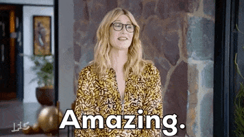 Celebrity gif. Laura Dern raises her eyebrows and smiles excitedly. Text, "Amazing."