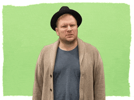 Celebrity gif. Patrick Stump looks at us and cringes like he just saw something disgusting.