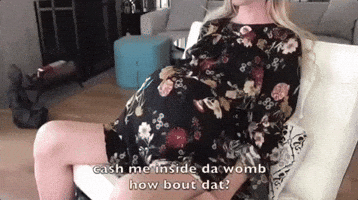 Video gif. Closeup of a woman's baby bump as she shifts to one side and back. Text, "Cash me inside da womb, how bout dat?"