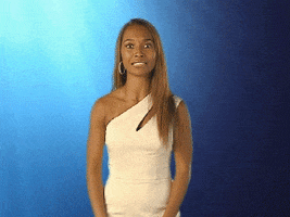 Celebrity gif. Eyes wide with surprise, Chilli from TLC reacts to something as she turns away and says, “Damn!”