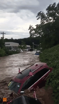 Raging Floods Wash Away Cars From New Jersey Dealership