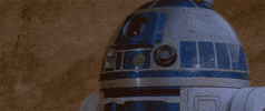 Star Wars gif. R2D2 falls straight onto the ground, and the word "dead" appears in the Star Wars font.