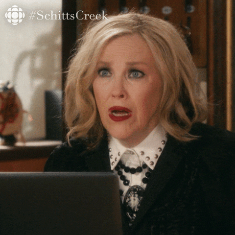 Schitt's Creek gif. Catherine O'Hara as Moira leans over a laptop and looks at someone across from her. She gasps and is genuinely shocked at what she has heard. She says, “Oh! Wow!” 