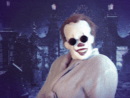 Movie gif. Pennywise from IT looks fashionable in a coat, gloves, and sunglasses. He shoots us a look over his shoulder and pulls his sunglasses down slightly, peering at us with sass.