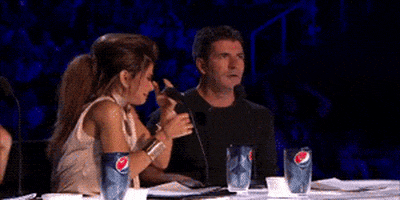 simon cowell surprise GIF