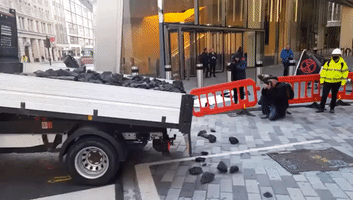 Climate Activists Dump Fake Coal Outside Lloyd's of London Headquarters