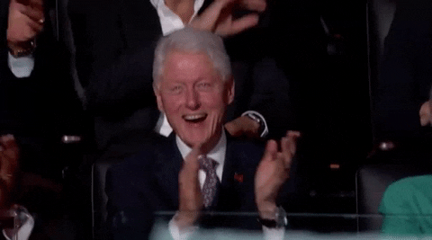 Political gif. Bill Clinton smiles and applauds as he sits in the audience of the 2016 Democratic National Convention.