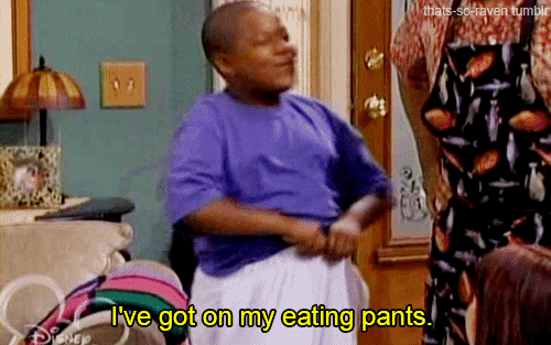 TV gif. Kyle Massey as Cory Baxter on That's So Raven pulls at his stretchy sweatpants and has a cheeky smile on his face as he says, “I’ve got on my eating pants.”