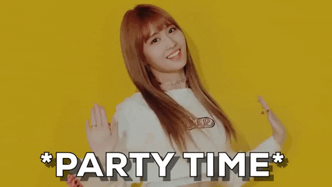 Video gif. Woman with long orange hair shimmies and shakes her shoulders against a sunflower yellow background. Text, "*Party Time*."