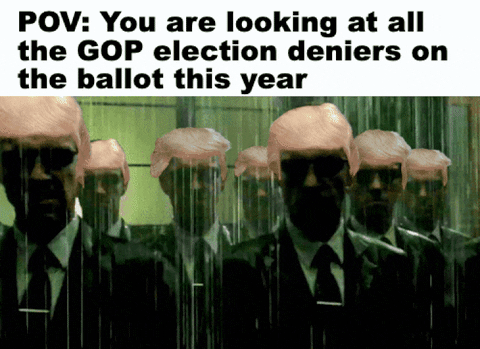 Movie gif. We scan across a crowd of agents wearing sunglasses agents from The Matrix wearing Donald Trump’s hair as they stand in the rain. Text, “POV: You are looking at all the GOP election deniers on the ballot this year.”