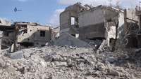 E. Damascus Suburb Heavily Damaged Following Air Raids, Ground Combat