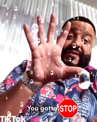 Celebrity gif. DJ Khaled puts up a hand as a spray of bubbles appears and yells, “Stop!.” Text, “You gotta stop.”