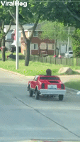 Dude Cruises Off in Tiny Car