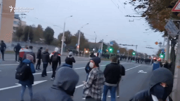 Belarusian Police Fire Stun Grenades at Anti-Government Marchers
