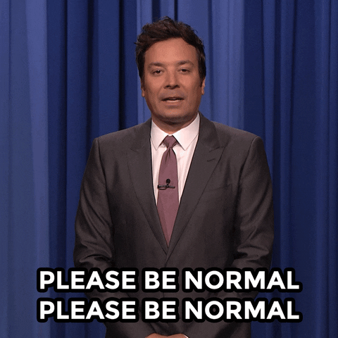 Tonight Show gif. Jimmy Fallon, standing alone, bows his head in prayer muttering "please be normal please be normal"