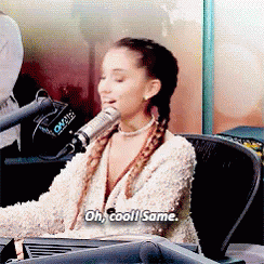 Celebrity gif. Ariana Grande behind a radio microphone smiles and says "oh, cool! Same." which appears as text.