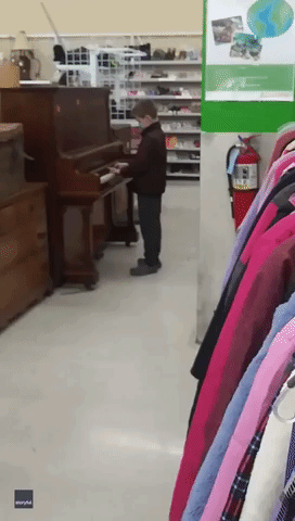 Talented Young Piano Player Entertains Customers at Massachusetts Charity Shop