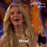 Sponsored gif. Video of Joan Vassos of The Golden Bachelorette, mouth agape, shocked and impressed. Text, "Wow!" The Golden Bachelorette, ABC, and Hulu logos in the upper right corner.