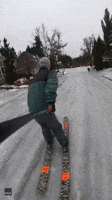 Man Skis Down Frozen Oregon Street
