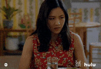 TV gif. Constance Wu as Jessica from Fresh Off The Boat. She raises her hands and drops her face into her palms as she sits at the table.