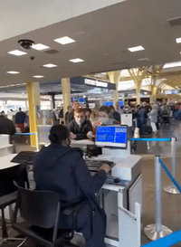 Travelers Wait at Virginia Airport as Thousands of Flights Delayed Amid FAA Outage