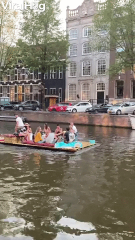Guy Pushes Raft Of People Down Canal GIF by ViralHog
