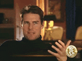 Celebrity gif. In interview setting, Tom Cruise breaks into laughter and claps his hands.