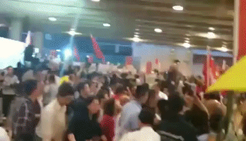 Pro-Democracy Protesters Scuffle With Police During CY Leung's Publicity Campaign