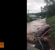 Flood Waters Sweep Away Cars From New Jersey Dealership