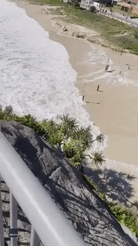 Waves Sweep Shipping Container Up Gold Coast Beach