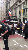Extinction Rebellion Activists Block Traffic and Hold Up Tourist Bus in New York City