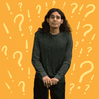 Video gif. Man leans on a cane as he bends forward with an exasperated expression and says, "O M G," which appears as text floating out of his mouth. Pale yellow question marks and exclamation points quiver in the marigold colored background around him.
