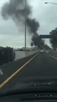 Airplane Crashes, Bursts Into Flames on Interstate 405