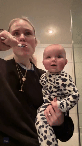 Adorable Baby Is Fascinated by Brushing Teeth