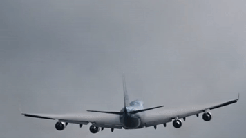 Airplane Flying Into Low Cloud Cover Creates Vortex and Swirls
