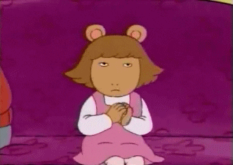 Cartoon gif. DW from Arthur sits on a couch, clapping slowly, with squinting eyes that look angry or bored.