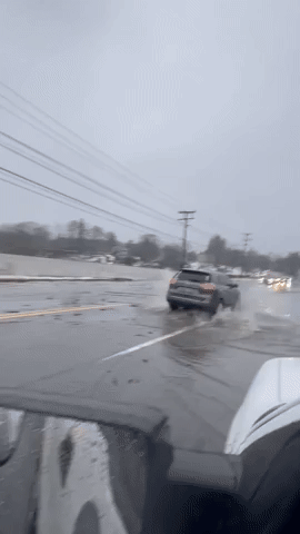 Drivers Splash Through Flooded Roads in Portland, Maine