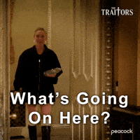 Sponsored gif. Traitors cast member Gabby Windey in The Traitors walks into a room and looks around with a slightly confused expression on her face. Text reads, “What’s going on here?”