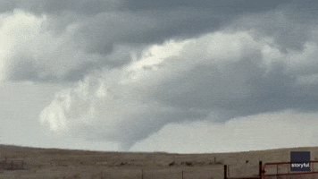 Funnel Cloud Hovers Over Windmill Farm