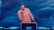 TV gif. In a clip from Family Game Fight, we see a shocked Dax Shepard standing behind a podium with his name on it, and he clutches his head as he turns away.