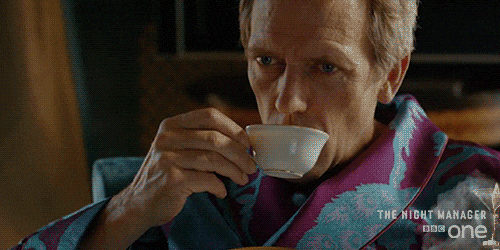 TV gif Wearing a robe Hugh Laurie as Richard in The Night Manager takes a sip of tea then closes his eyes in pleasure as he swallows