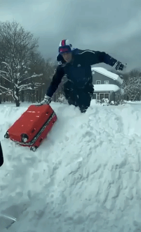 Bills Fan Makes His Way Through Snowfall