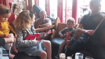 Toddler Hones His Fiddle Skills