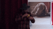 Video gif. A man fixes his pocket square in his plaid jacket and nods his head as he speaks what appears on screen. Text, "Facts!"