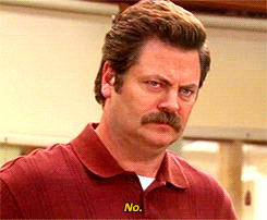 Parks and Recreation gif. Nick Offerman as Ron Swanson on Parks and Recreation has a serious expression on his face as he firmly says, “No.”