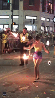 Hot Stuff: Police Officer Twirls Flaming Baton at Alabama Mardi Gras Parade
