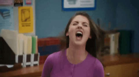 TV gif. Alison Brie as Annie in Community screams with rage in the study room, her mouth wide open and her eyebrows up, shaking her head and moving her shoulders back.