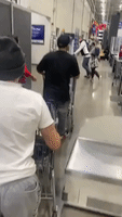 Men Rush to Car With Loaded Shopping Carts After Ignoring Store Staff's Receipt Request