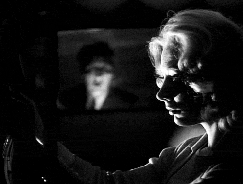 a girl walks home alone at night GIF